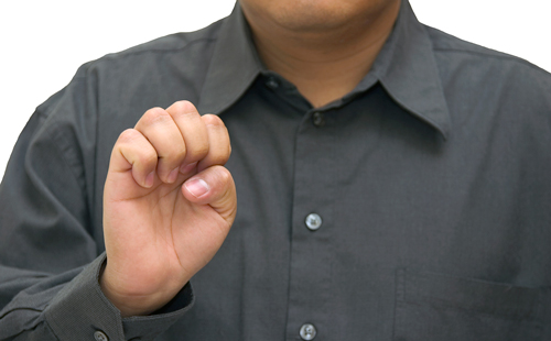 man signing with his right hand