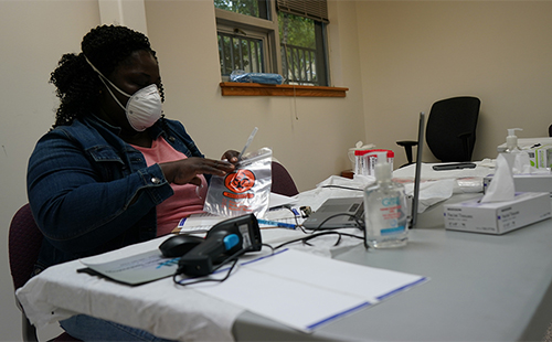 Nurse preparing COVID-19 testing swabs