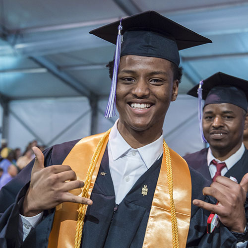 Student at graduation in cap and gown