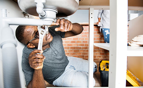student learning plumbing repairs