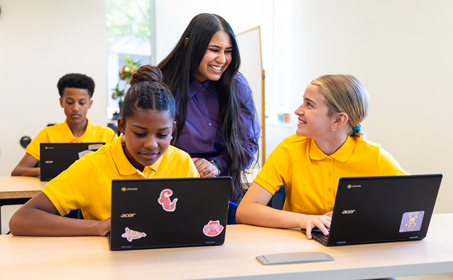 Mariam smiling at a student while teaching.